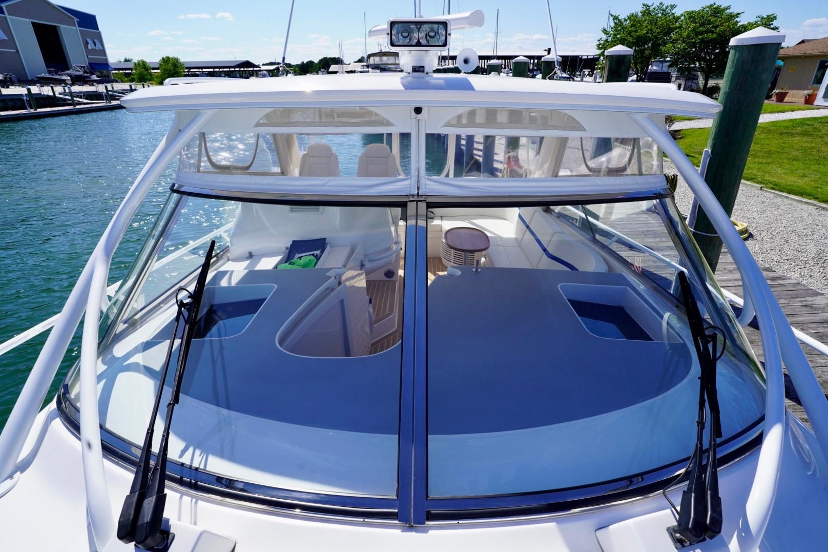 2017 Intrepid 475 Sport Yacht docked, showcasing sleek design and spacious deck.
