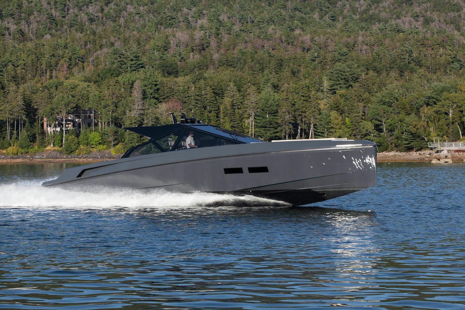 Wallypower 52 yacht cruising on a lake, surrounded by lush forest, 2016 model.