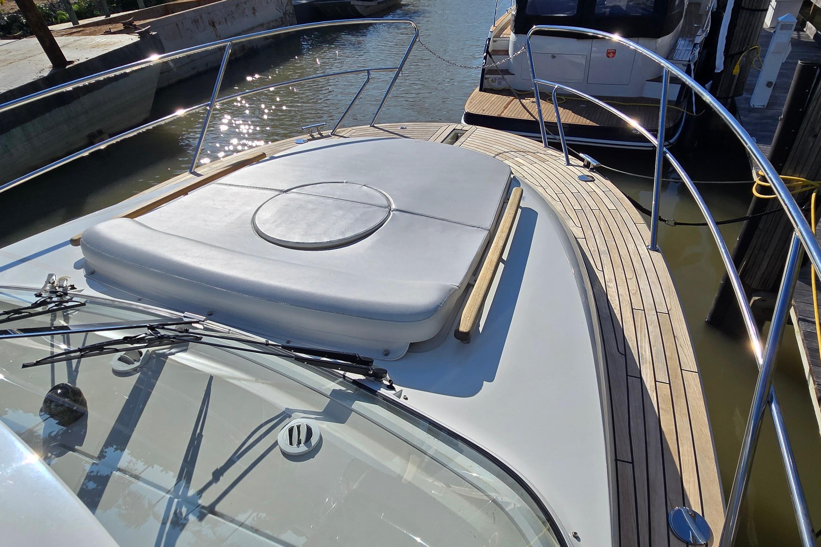 2025 Marex 310 Sun Cruiser boat with sleek deck design and sunbathing area.