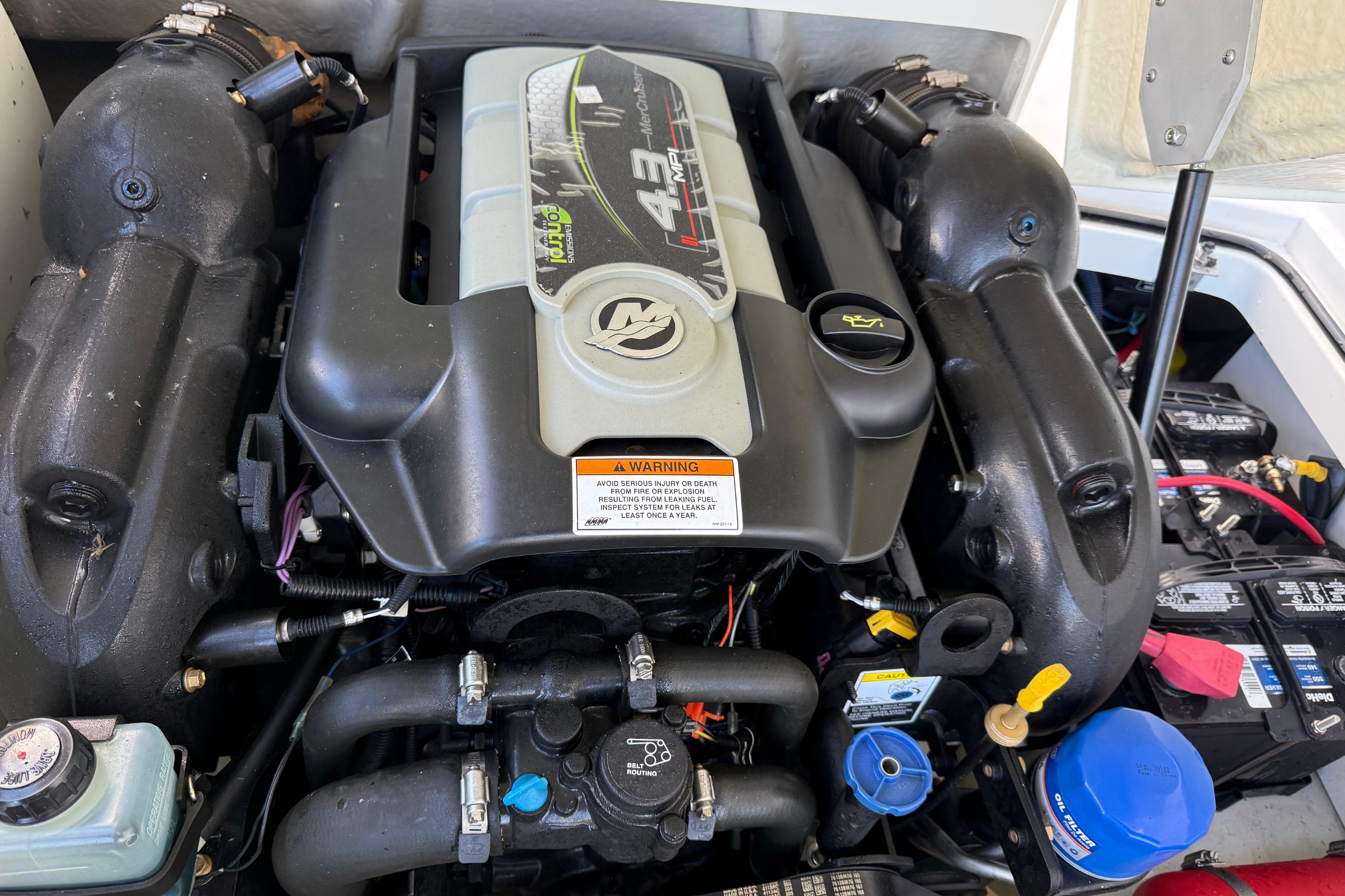 Engine compartment of a 2015 Cobalt 200 boat, featuring a 4.3L V6 engine.