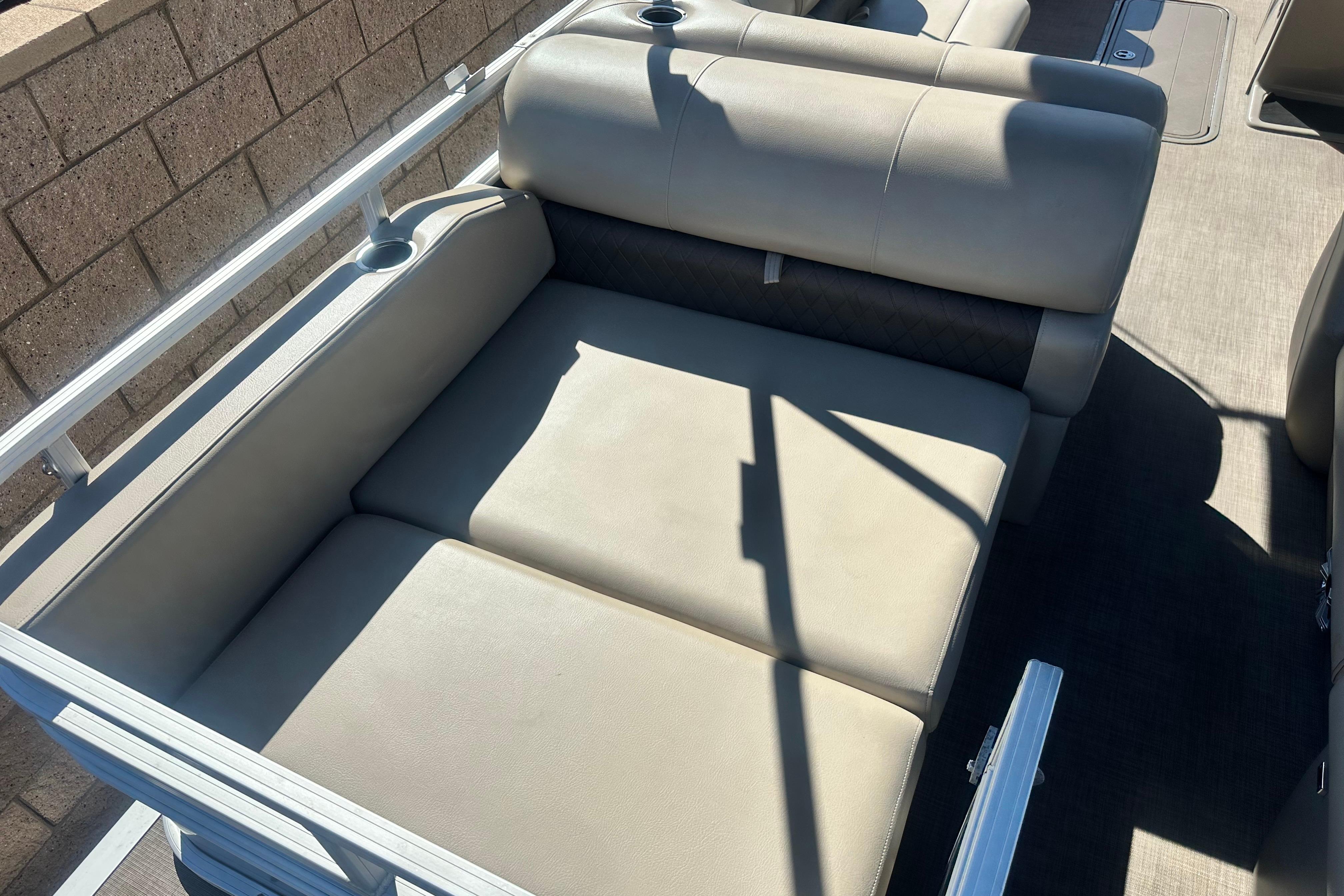 2023 Sun Tracker Party Barge 22 RF XP3 seating area with cup holders.