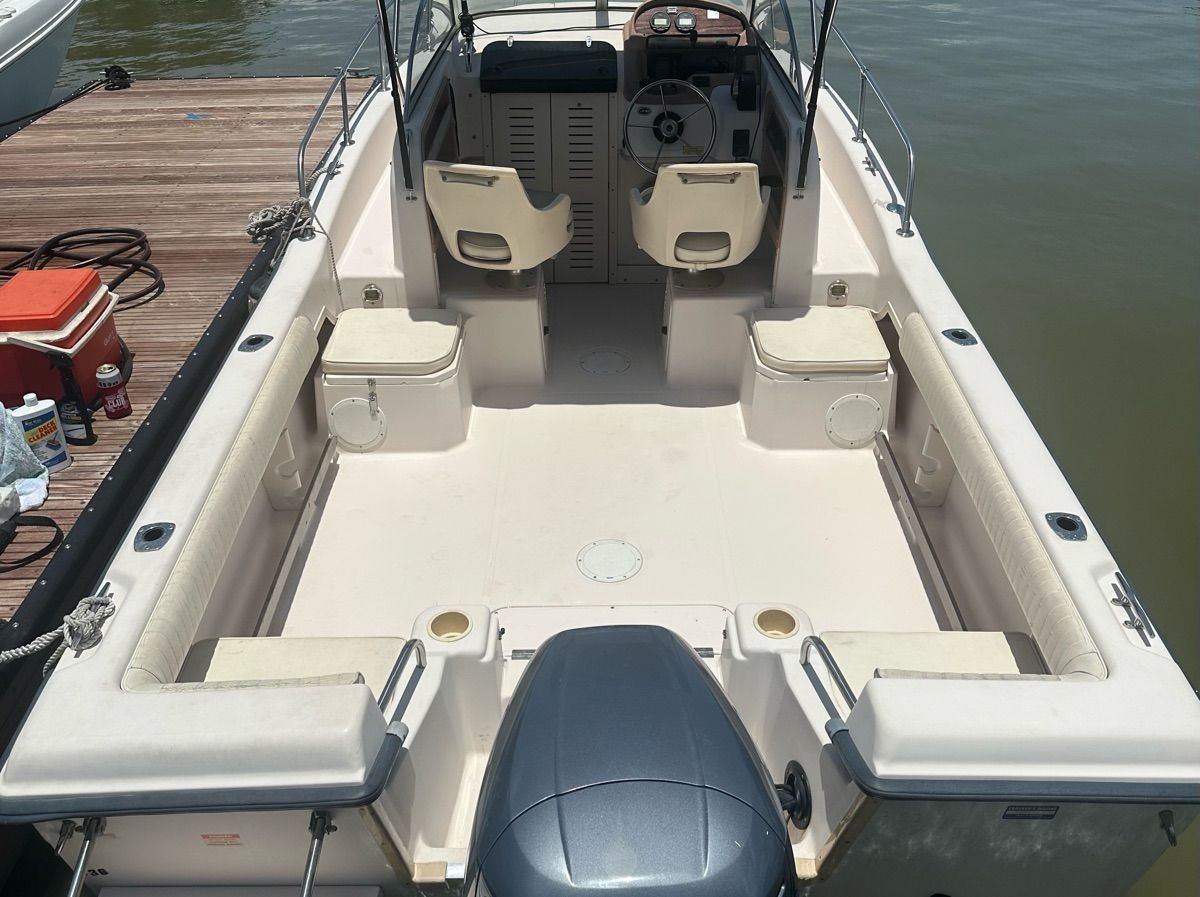 The image shows the cockpit of a 1998 Grady-White Adventure 208 boat.