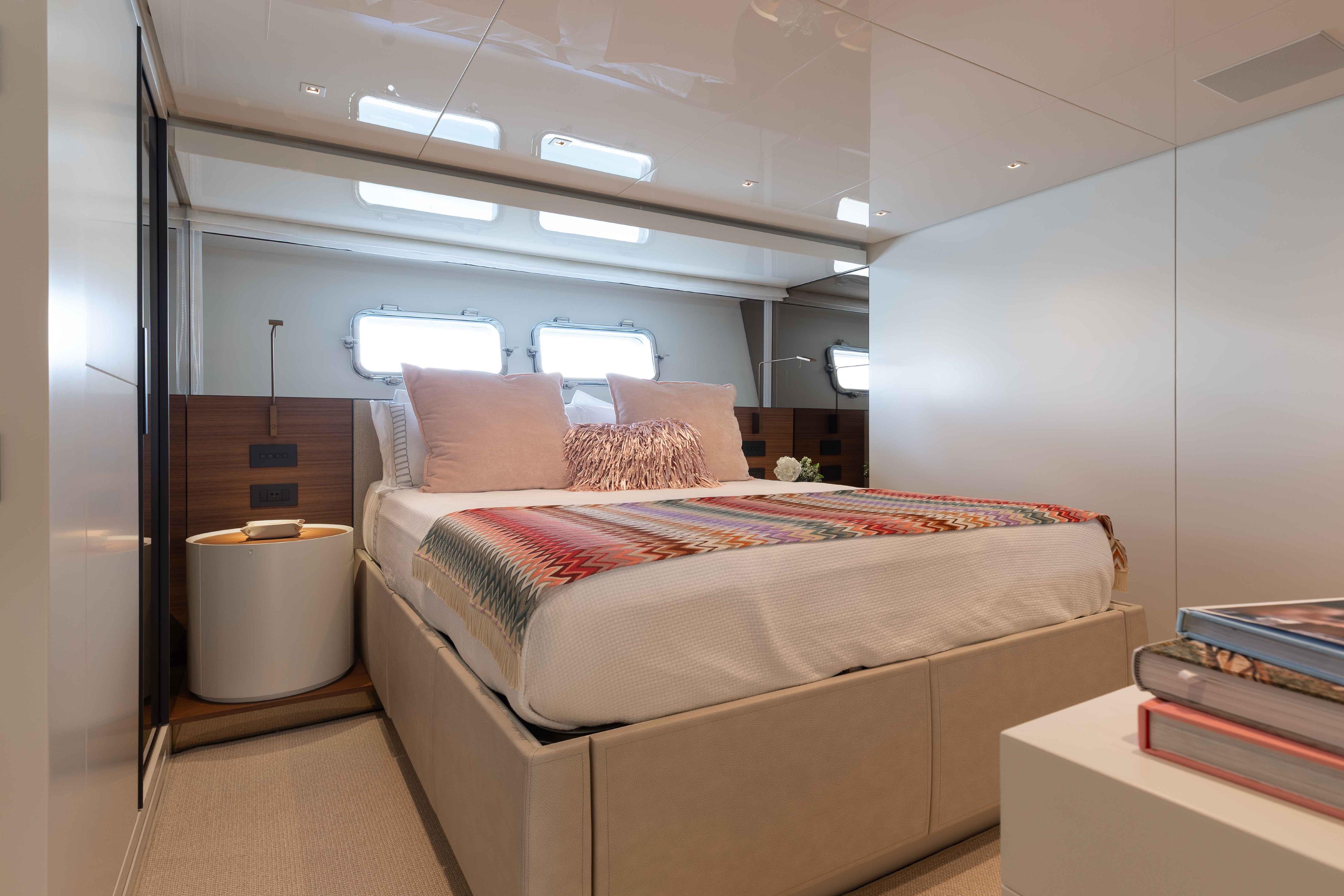 Luxurious bedroom interior of 2024 Sanlorenzo SL90A yacht with modern decor and natural light.