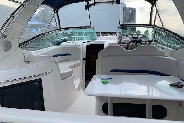 2003 Chaparral Signature 280 boat interior with seating and helm.
