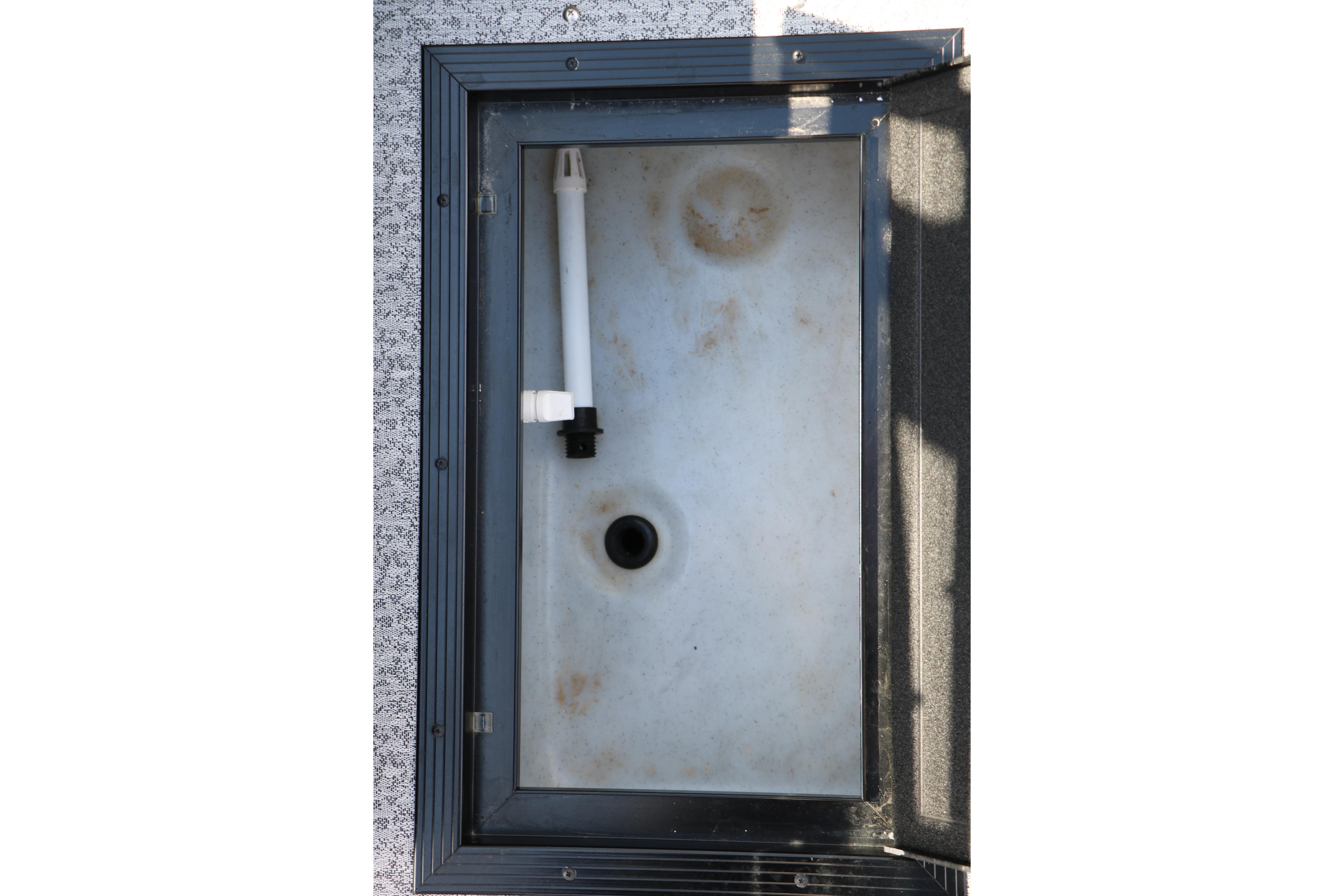 Storage compartment of 2025 Smoker Craft Adventurer 188 DC boat, featuring a white interior.
