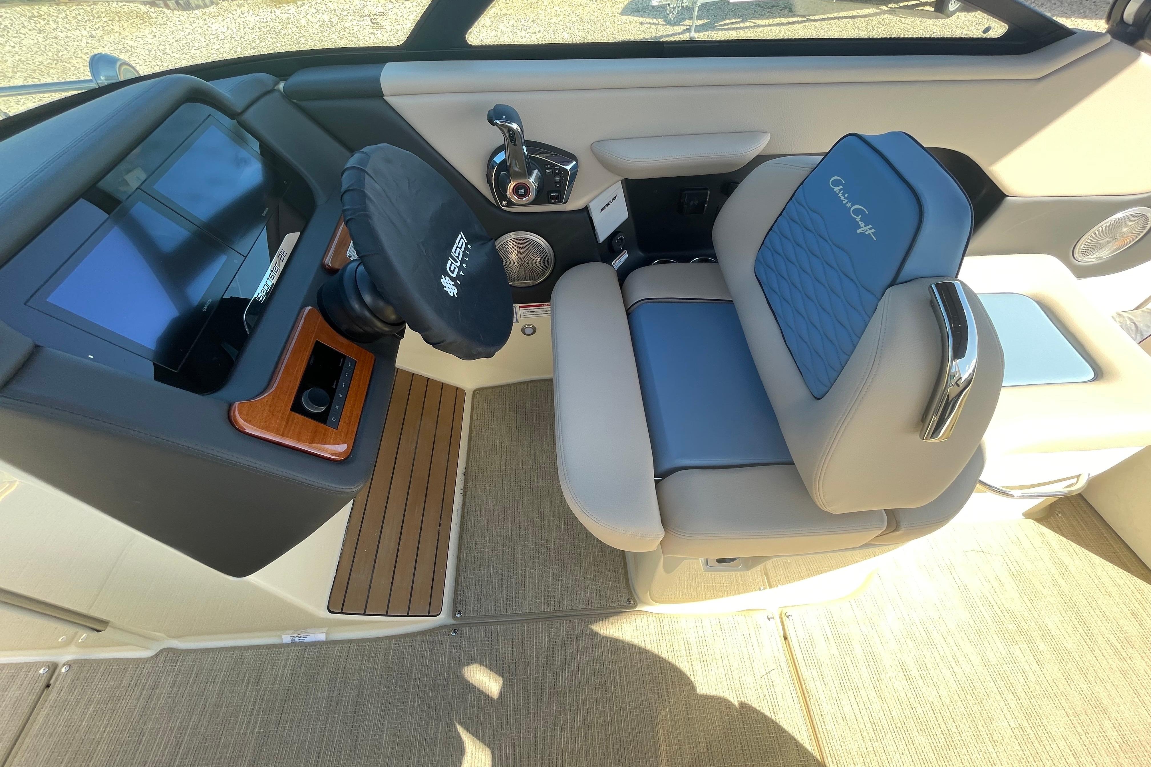 2026 Chris-Craft Sportster 28 cockpit with modern steering and luxurious seating.