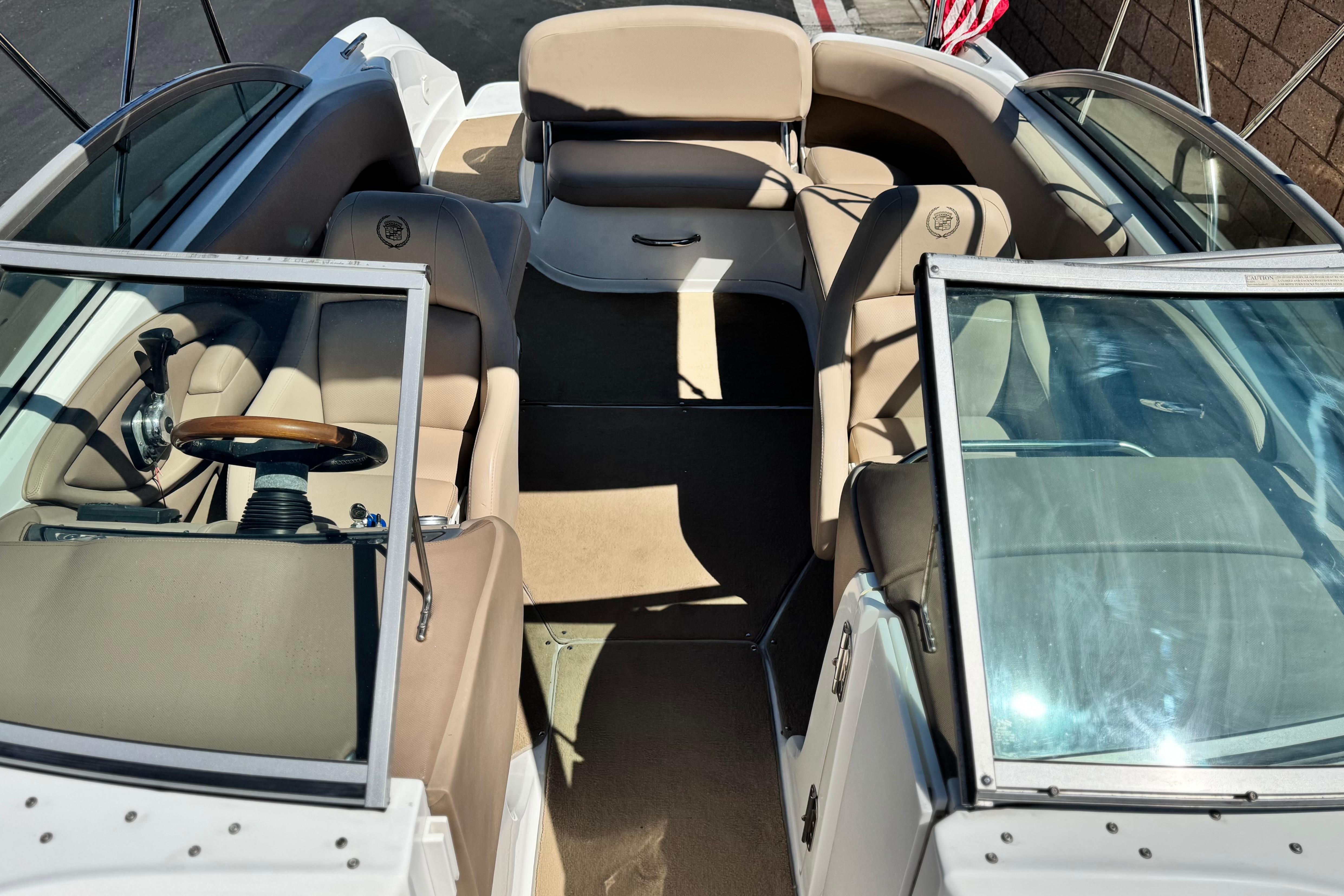 2008 Cobalt 262 boat interior with beige seating and steering wheel.