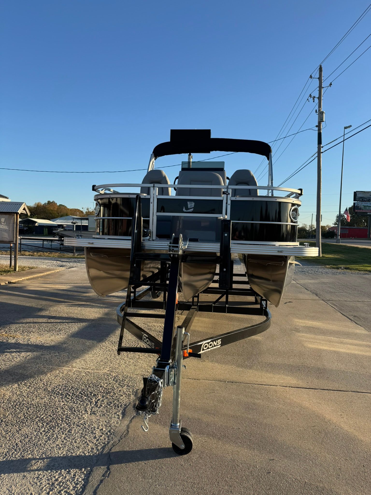 2026 Landau Alure 21CC Fish boat on trailer, front view.