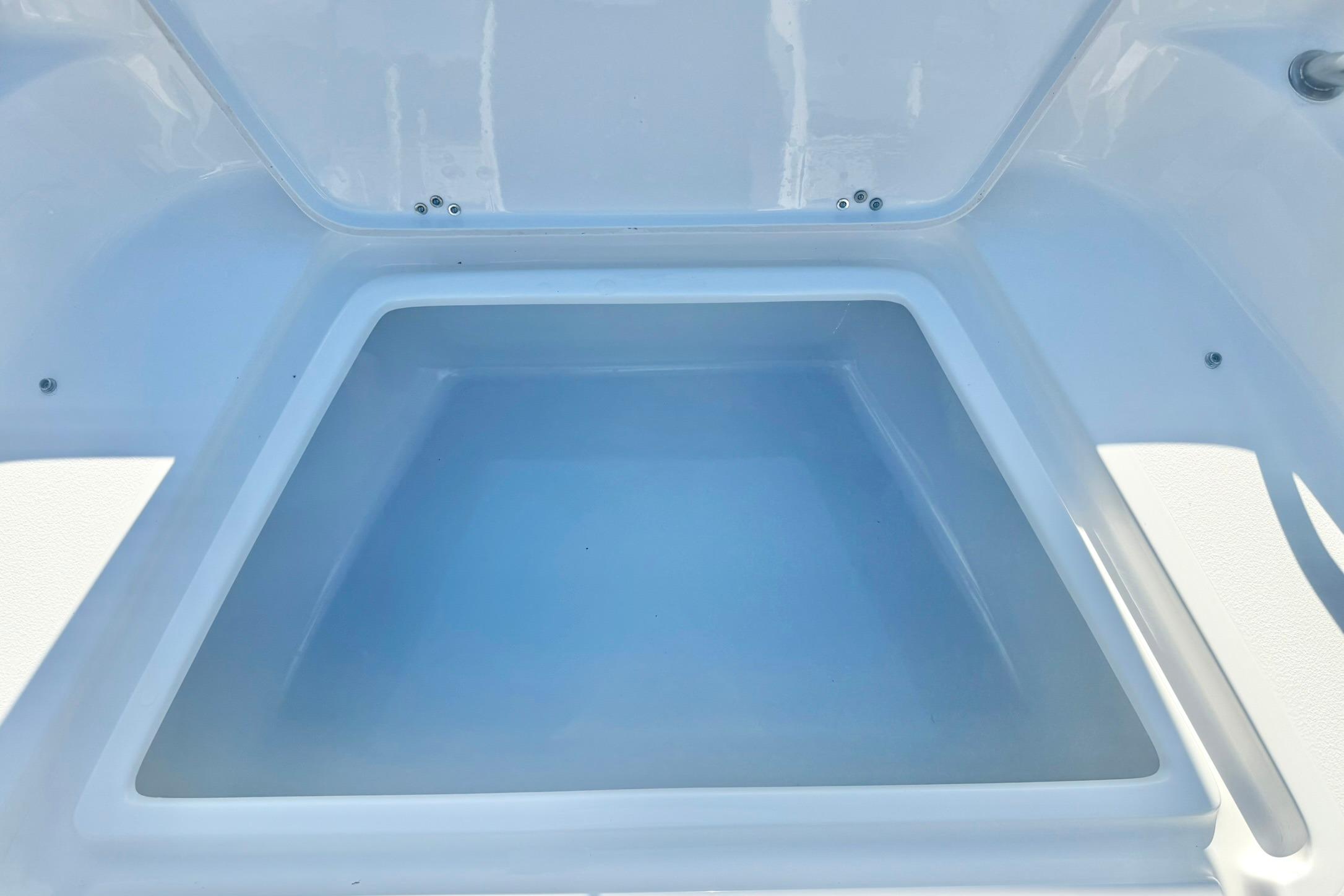 Storage compartment of 2026 Key West 189 FS boat, open and empty.