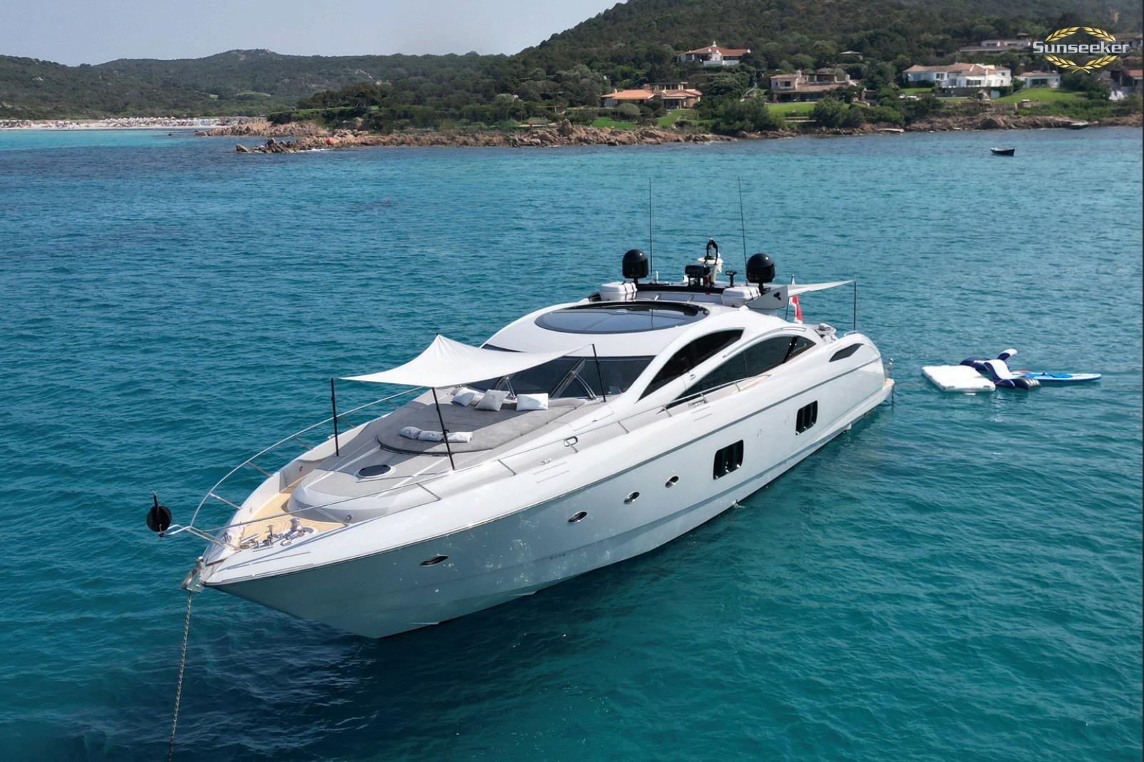 Luxurious 2007 Sunseeker Predator 82 yacht anchored in clear blue waters.