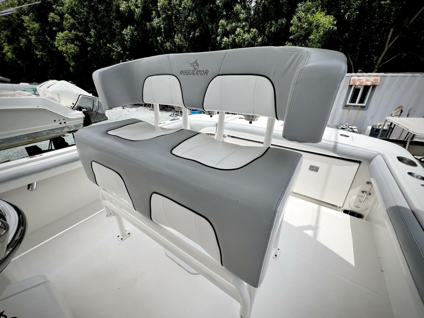 2020 Regulator 23 boat seating with gray and white upholstery.