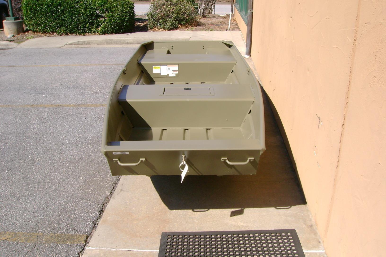 2026 Tracker Grizzly 15 Jon boat in outdoor setting, showcasing its sturdy design.