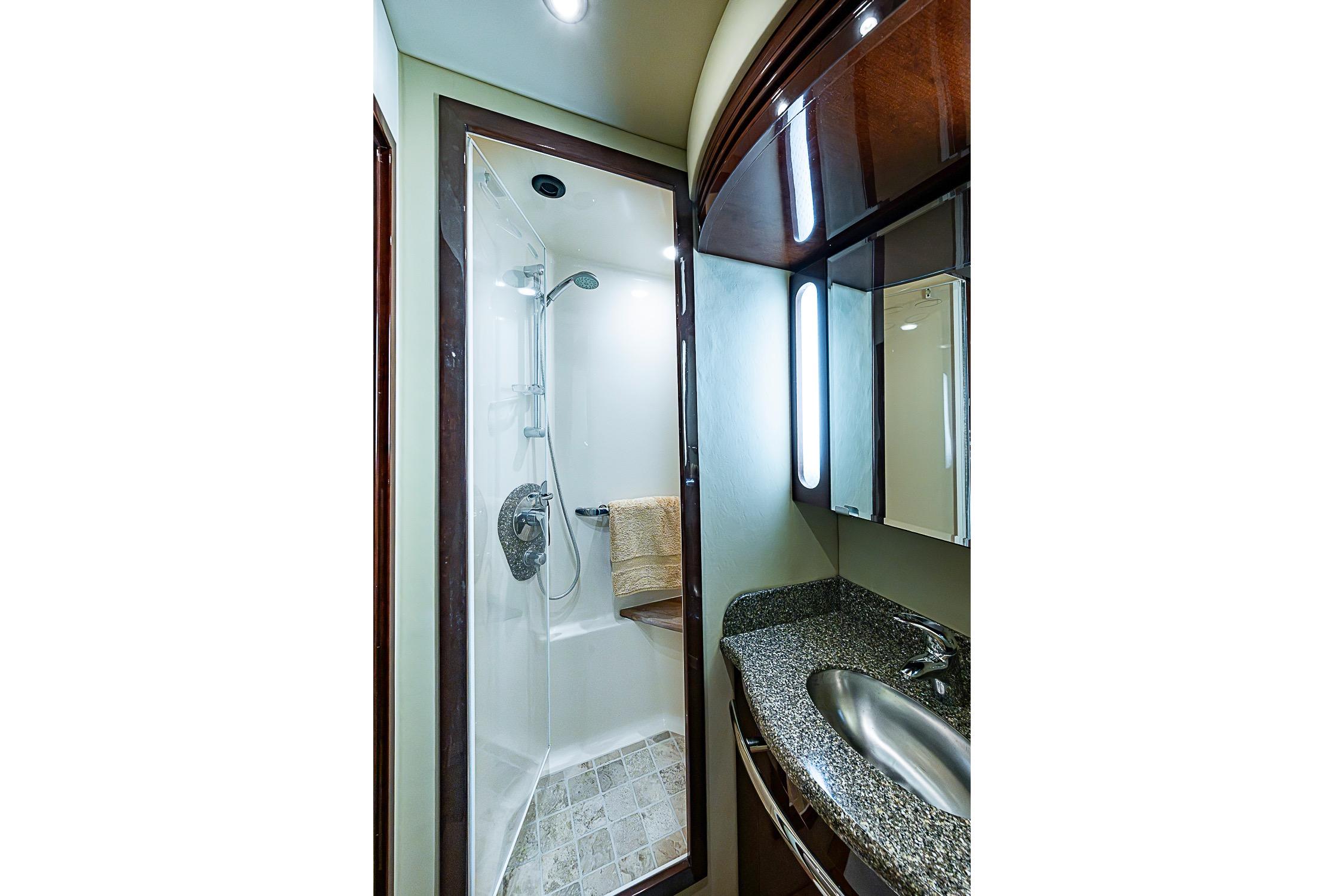 Luxurious bathroom in 2008 Sea Ray 60 Sundancer yacht with modern shower and sleek sink.