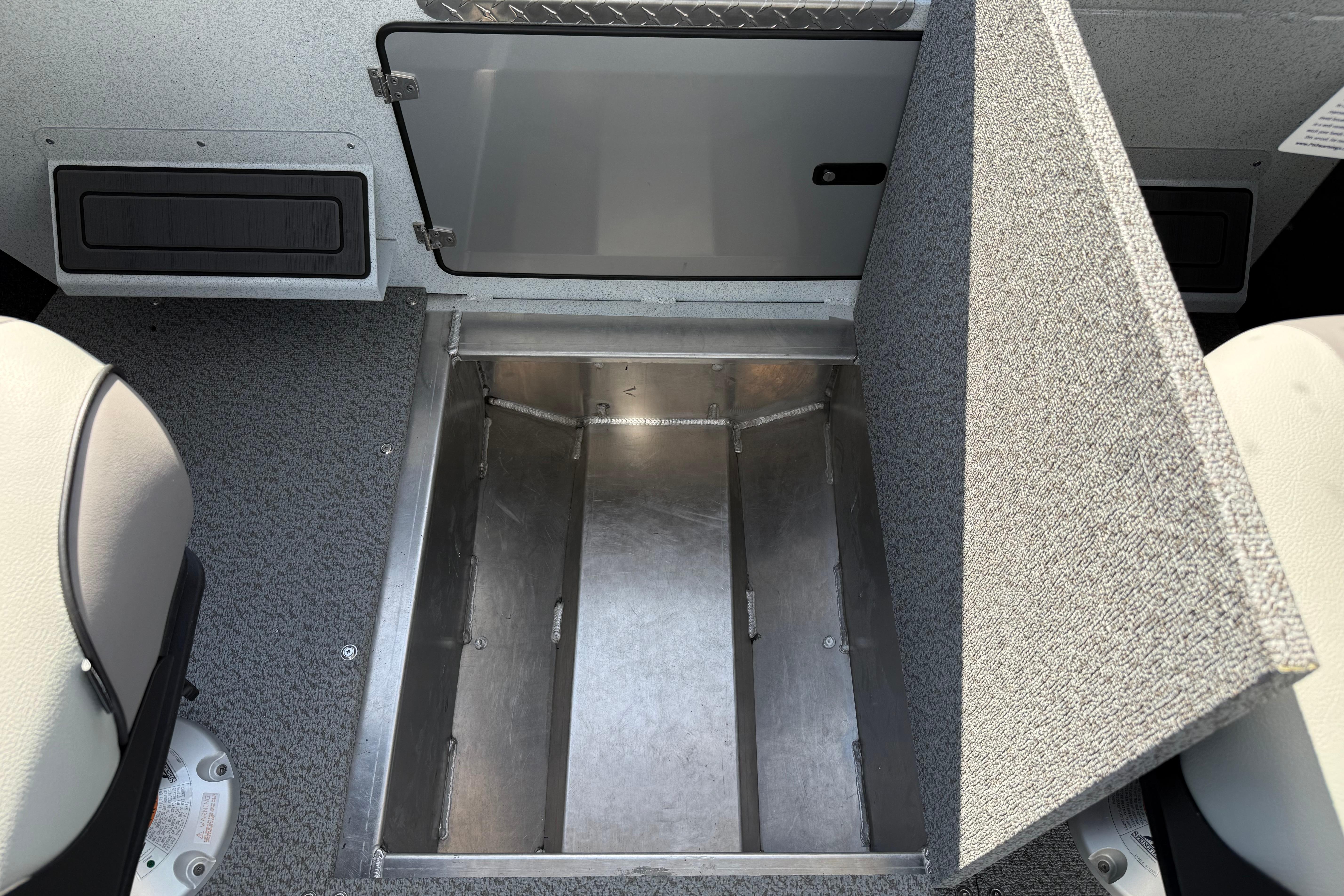 Storage compartment in 2026 KingFisher 2425 Escape HT boat interior.