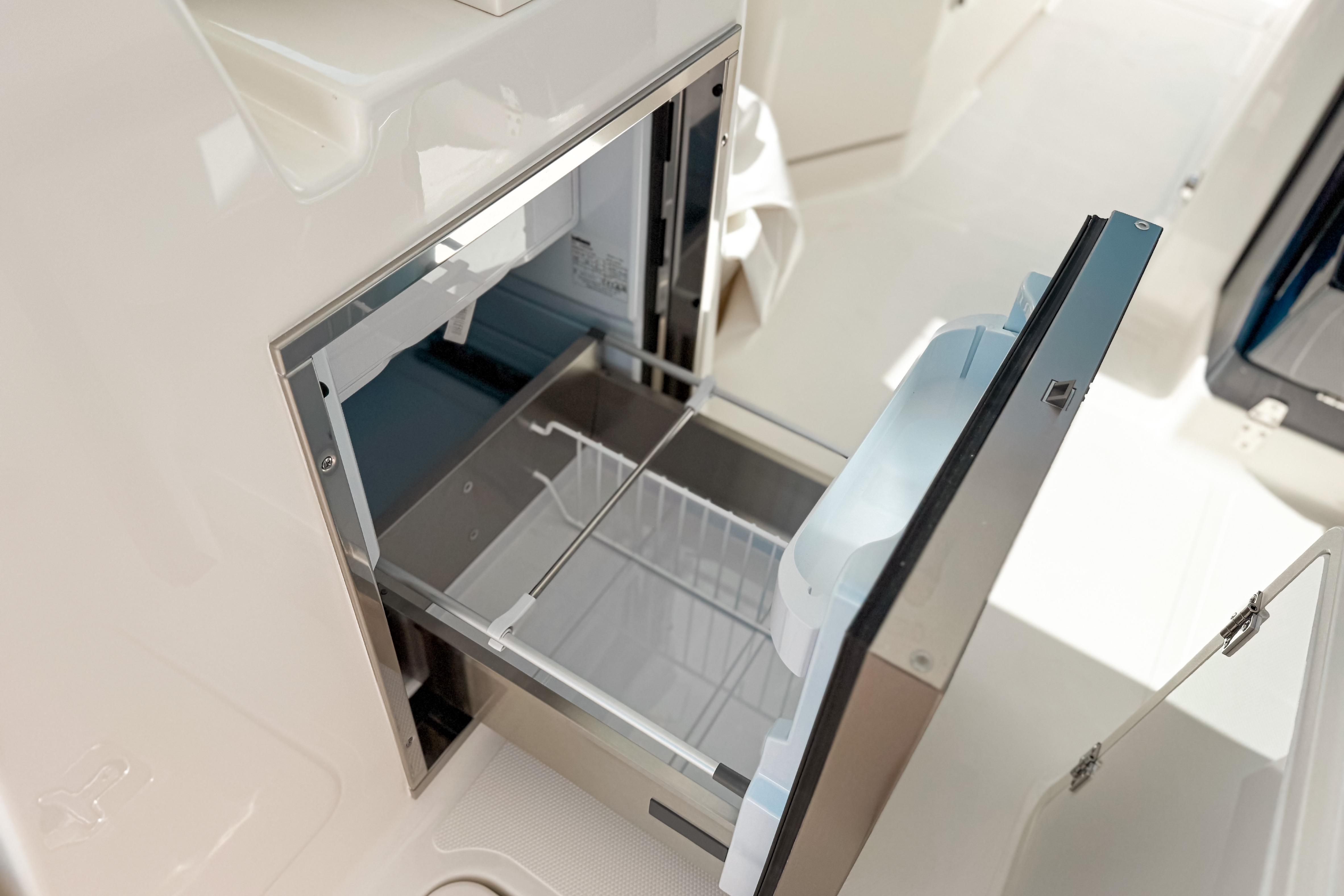 2026 Pursuit DC 306 Dual Console boat with open storage compartment.