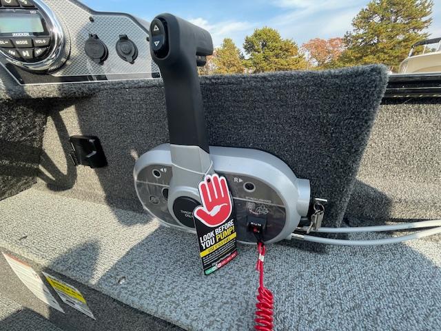 2025 Lund 1650 Rebel XL SS boat throttle control with safety tag.