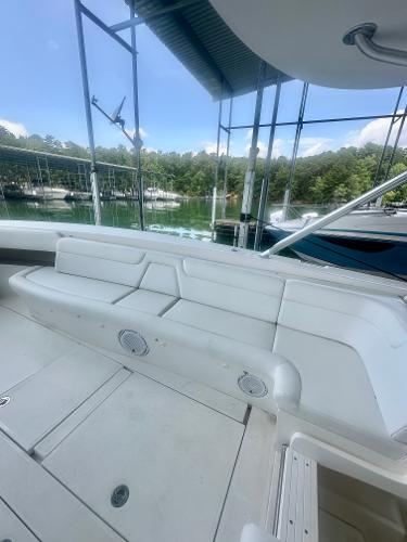 2008 SeaVee 390B boat interior with white seating, docked at a marina.