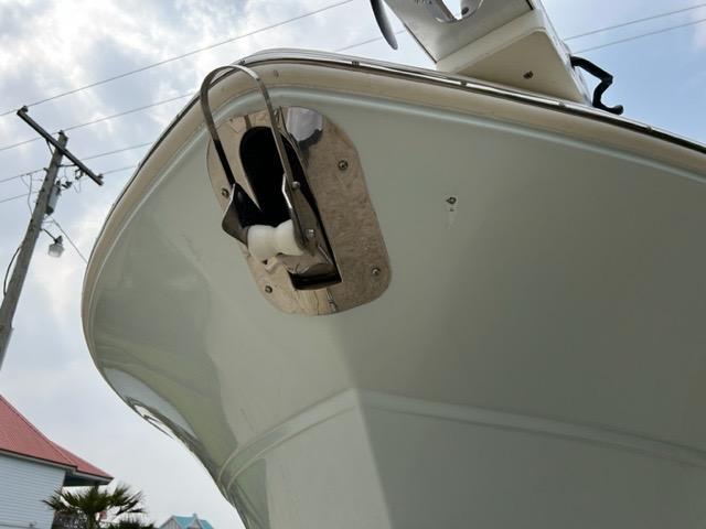 2019 Sea Fox 328 Commander boat bow with anchor detail under cloudy sky.