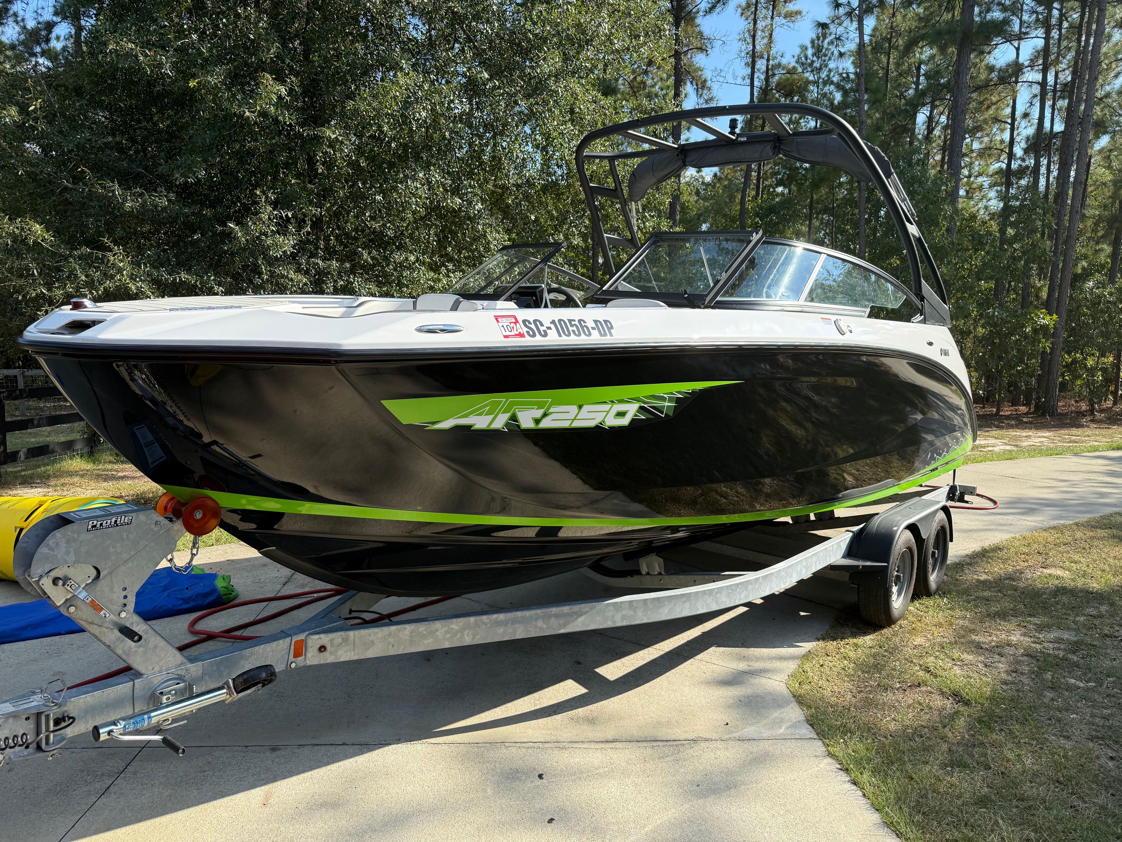 2021 Yamaha AR250 boat parked on trailer outdoors.