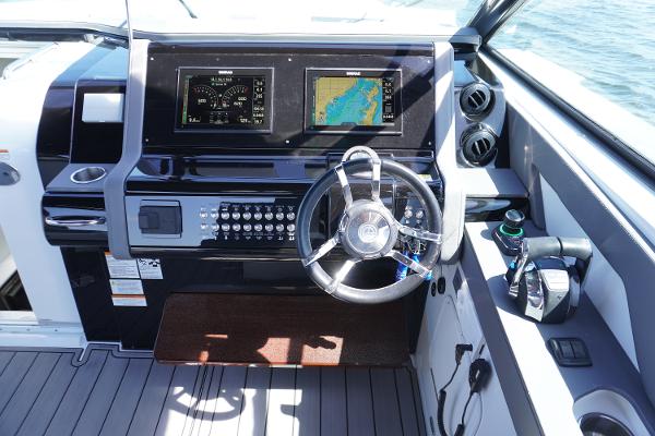 Helm of 2020 Cruisers Yachts 38 GLS OB with dual displays and controls.