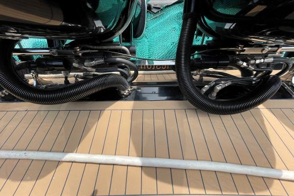 2020 Scout 420 LXF boat deck with engine components and teak flooring.