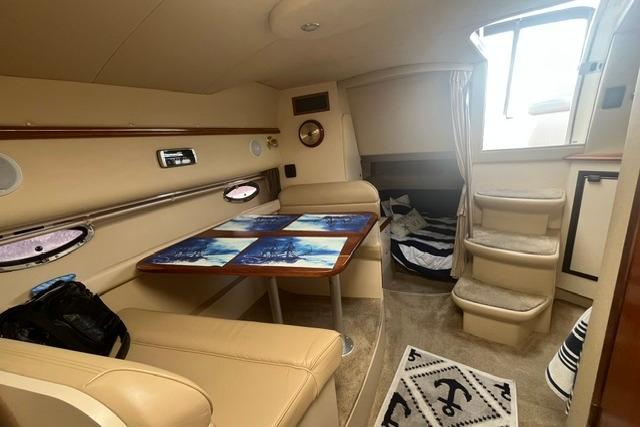 Interior of 2004 Cruisers Yachts 3372 Express with seating and dining area.