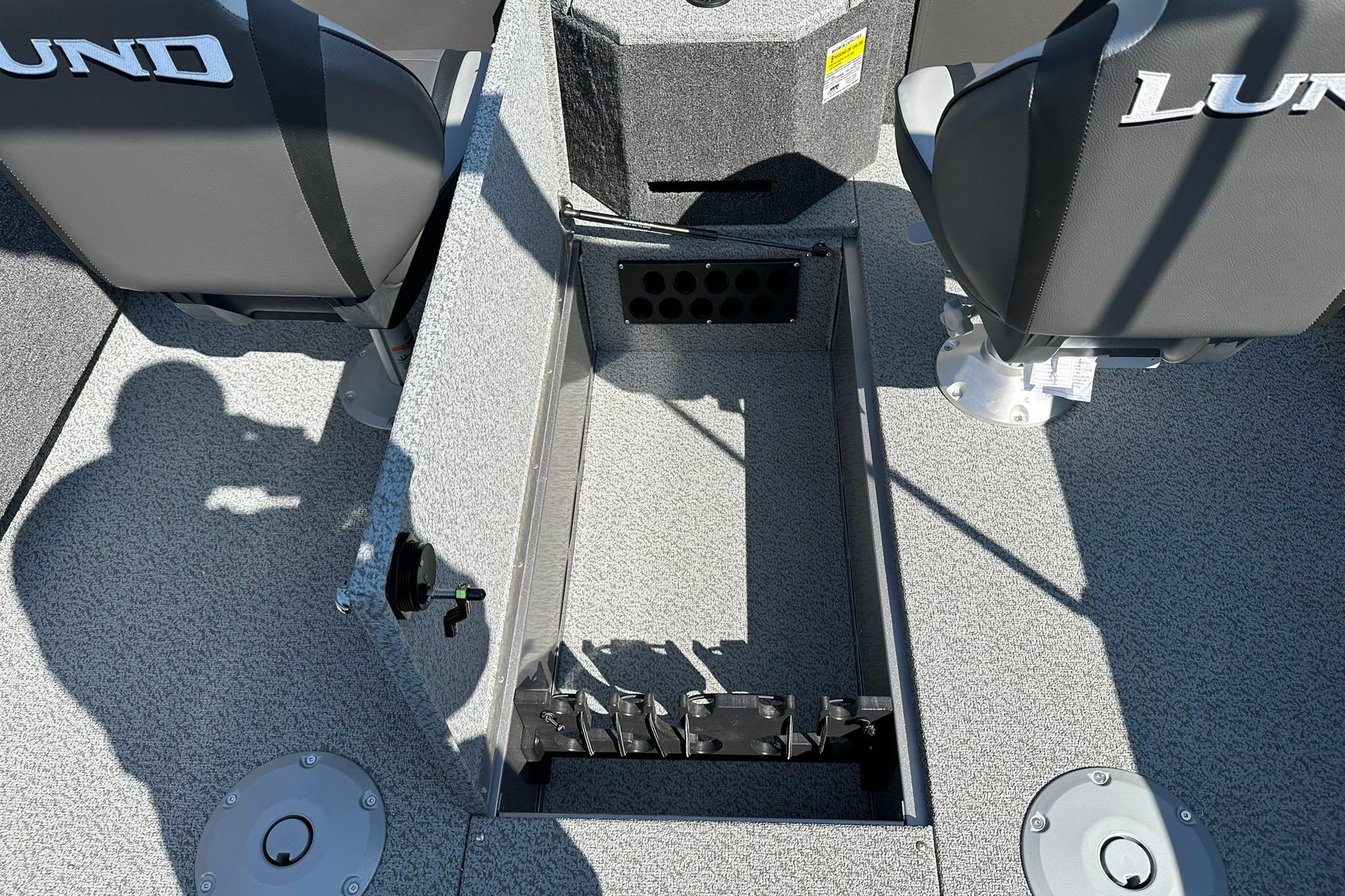 2026 Lund 1875 Fisherman boat interior with open storage compartment and seating.