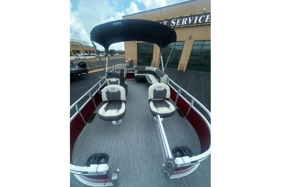 2026 Sun Tracker Bass Buggy 16 XL Select pontoon boat with spacious seating and canopy.