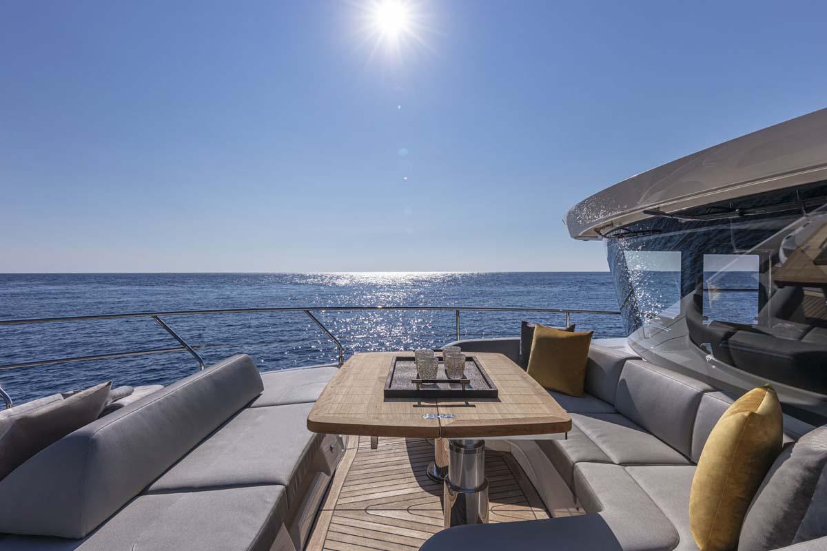 Manufacturer Provided Image: Luxurious deck seating on the 2022 Absolute 64 Navetta yacht with ocean view.
