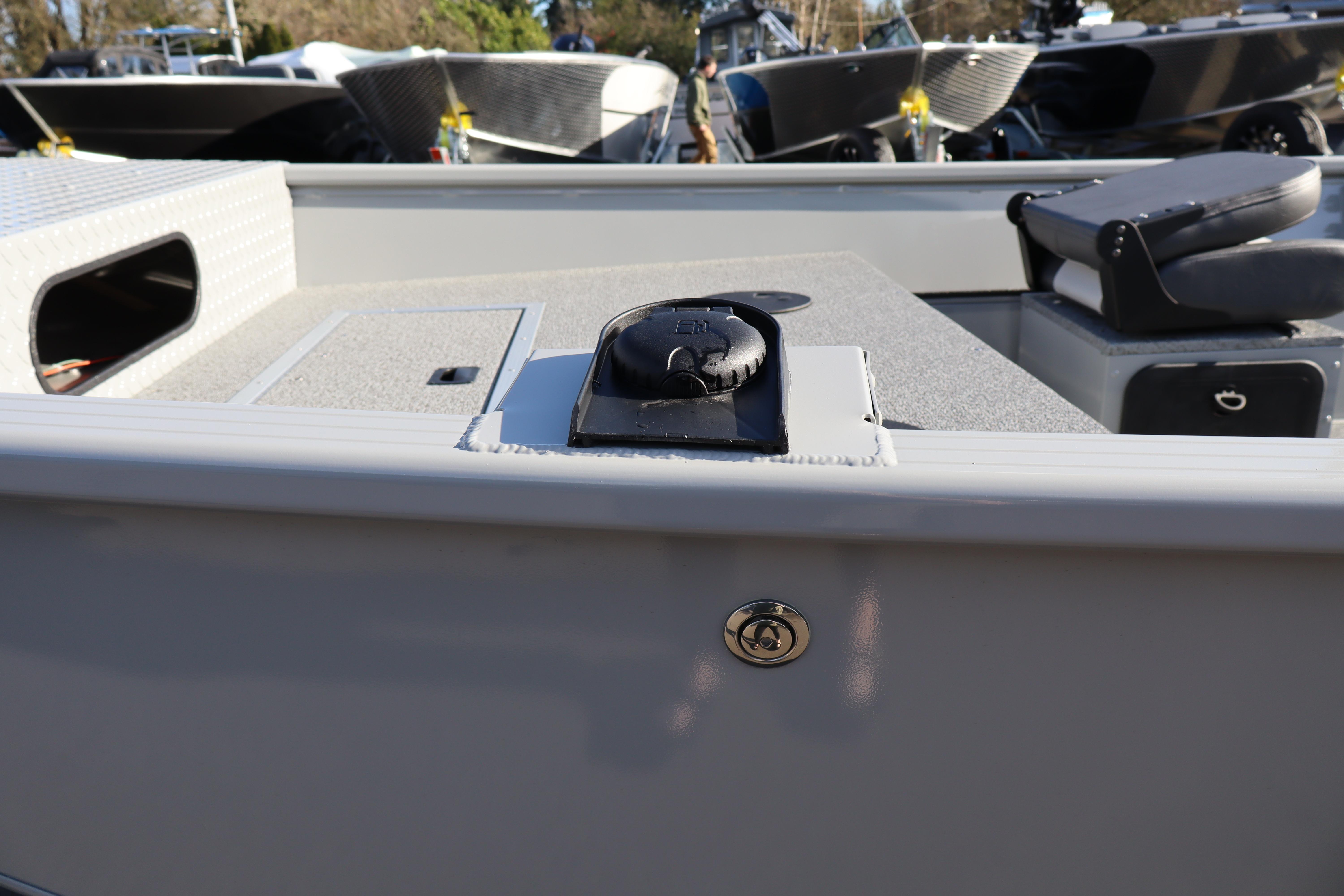 2026 Smoker Craft Pro Sportsman 1660 boat interior with seating and storage compartments.