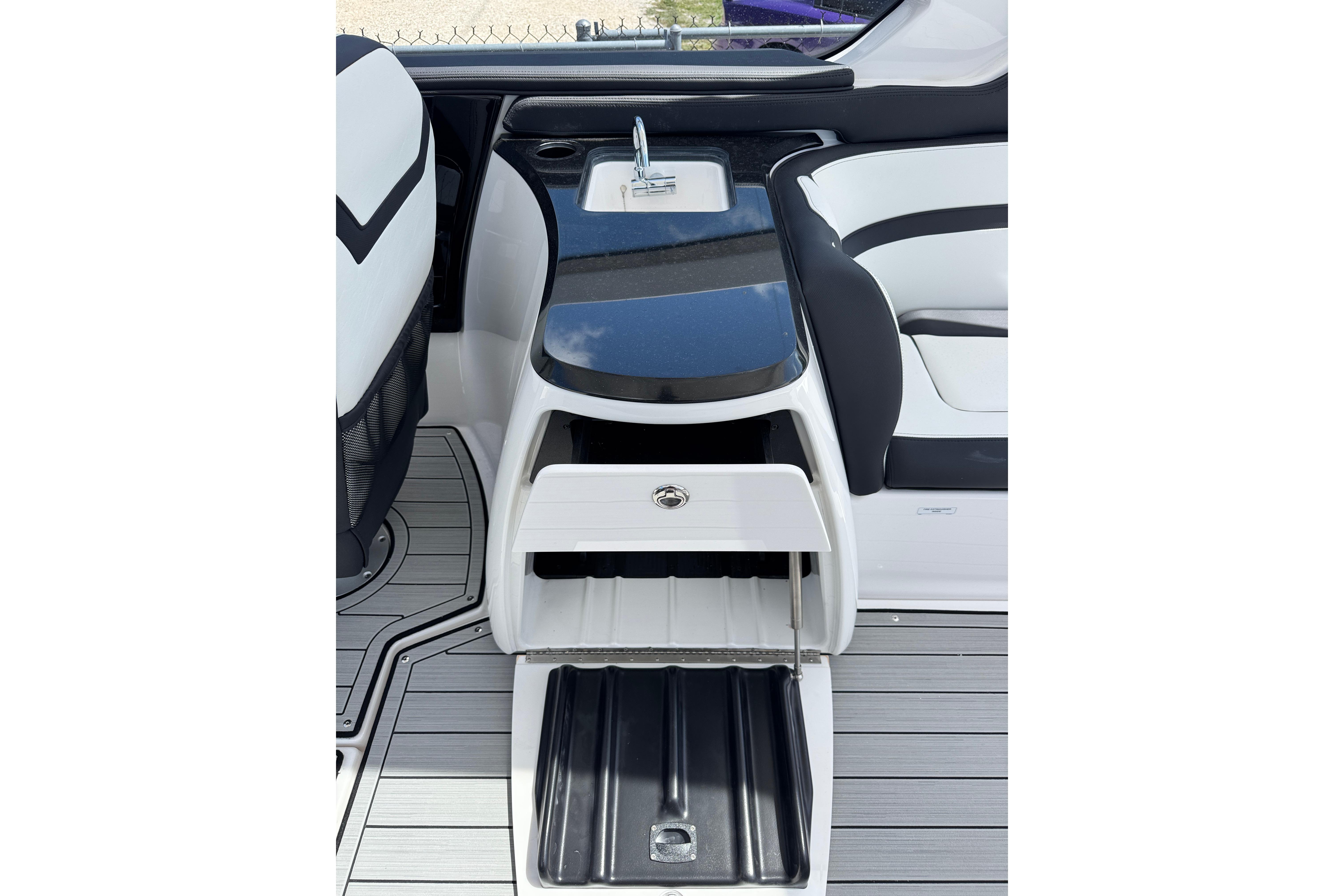 2026 Yamaha Boats 275SD interior with sleek sink and storage compartments.