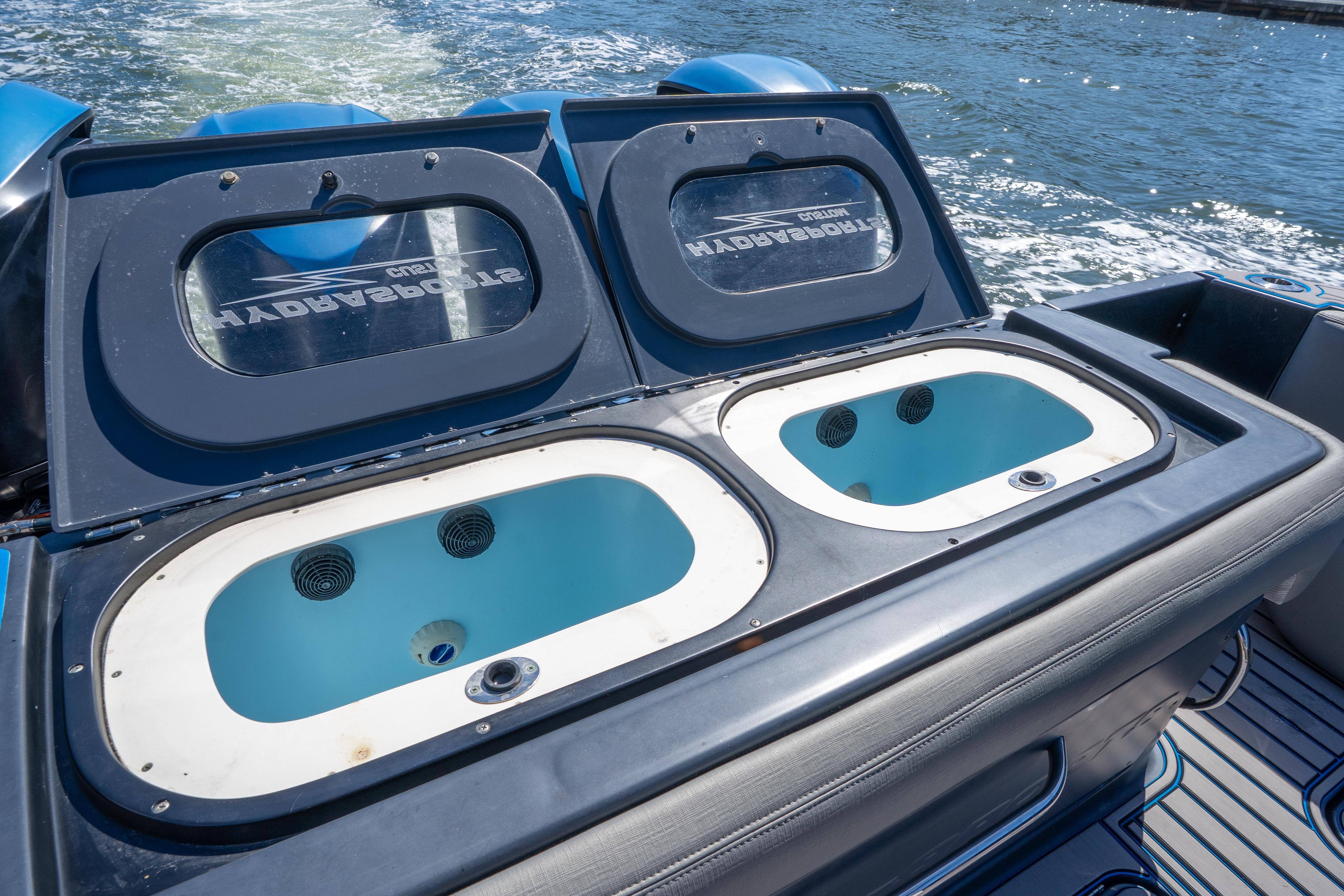 2016 Hydra-Sports 4200 Siesta boat with dual livewells on deck, cruising on water.