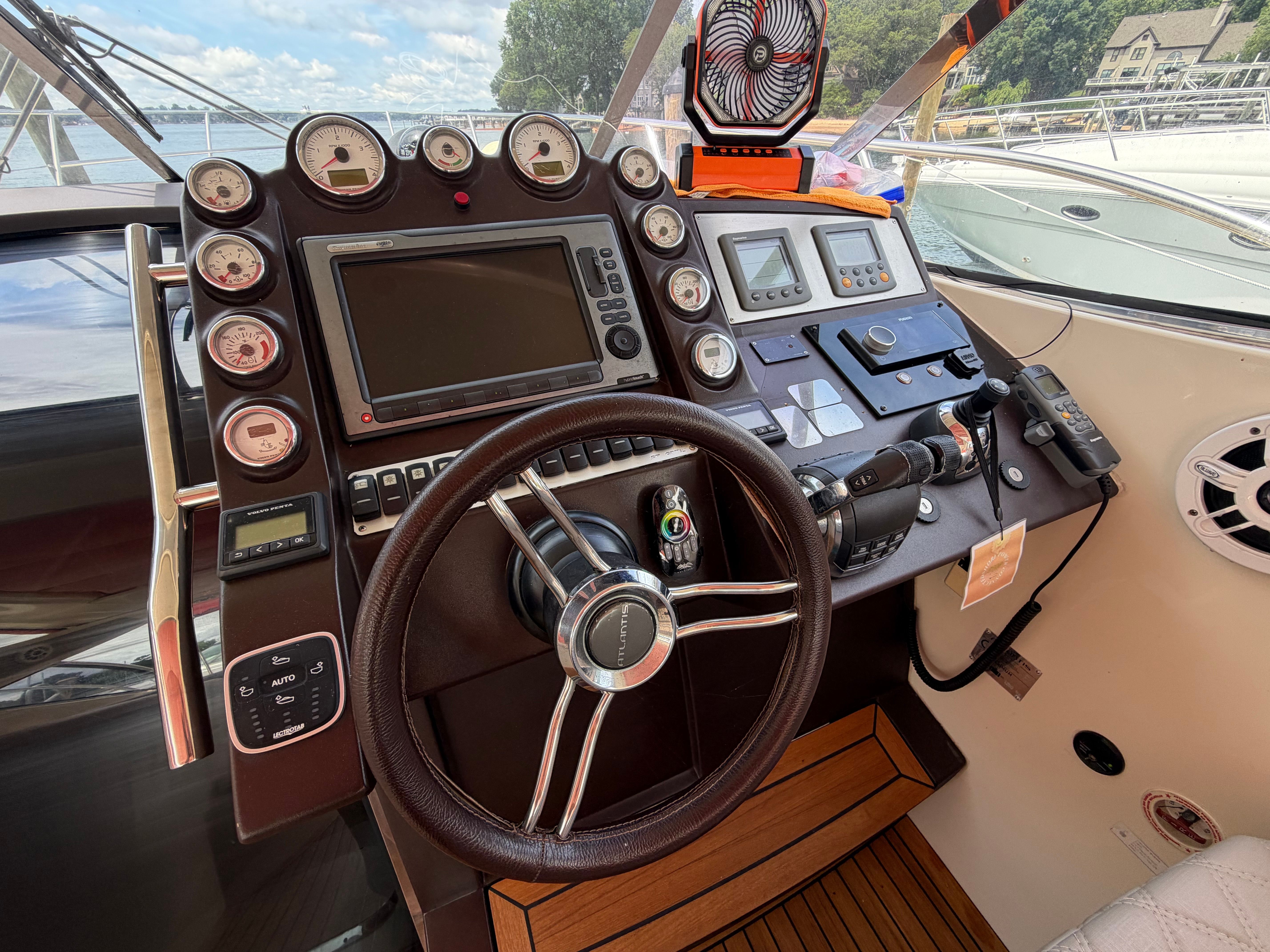The 2011 Azimut Atlantis 40 cockpit features a modern helm with numerous instruments.