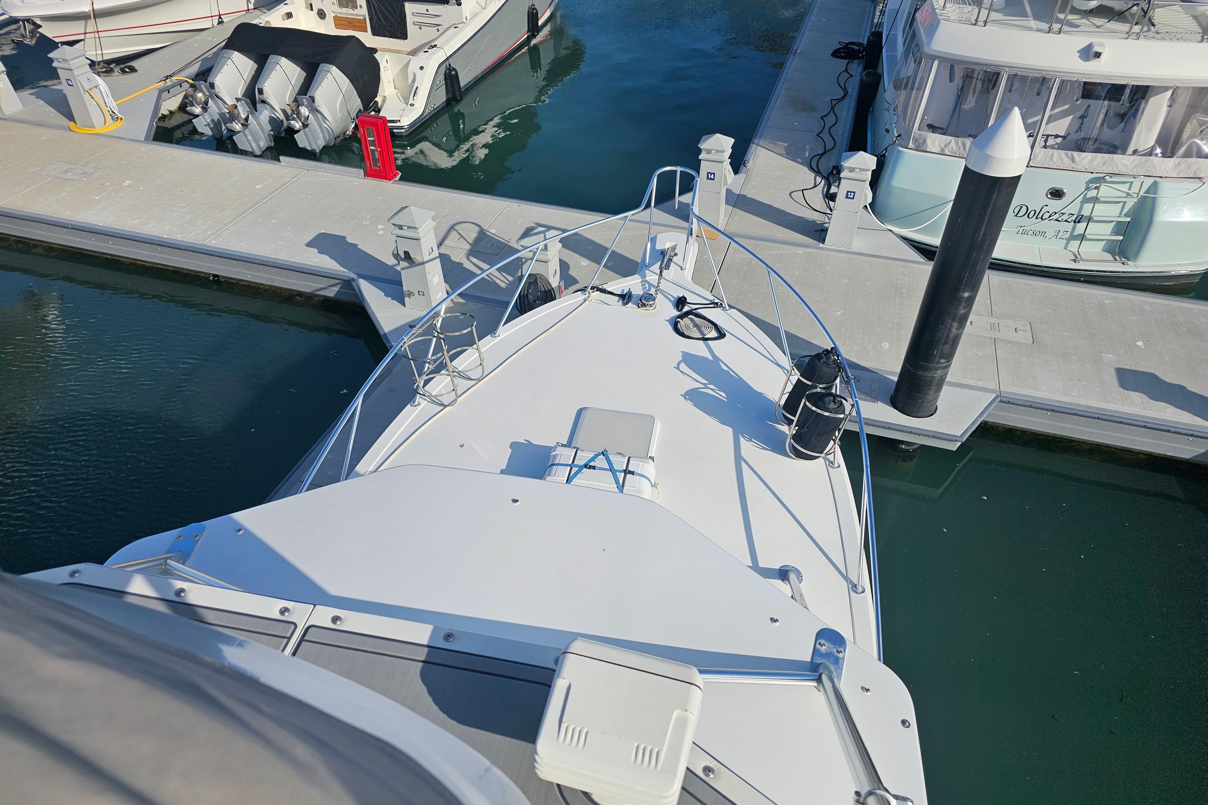 2003 Topaz 32 Express yacht docked at marina, viewed from above.