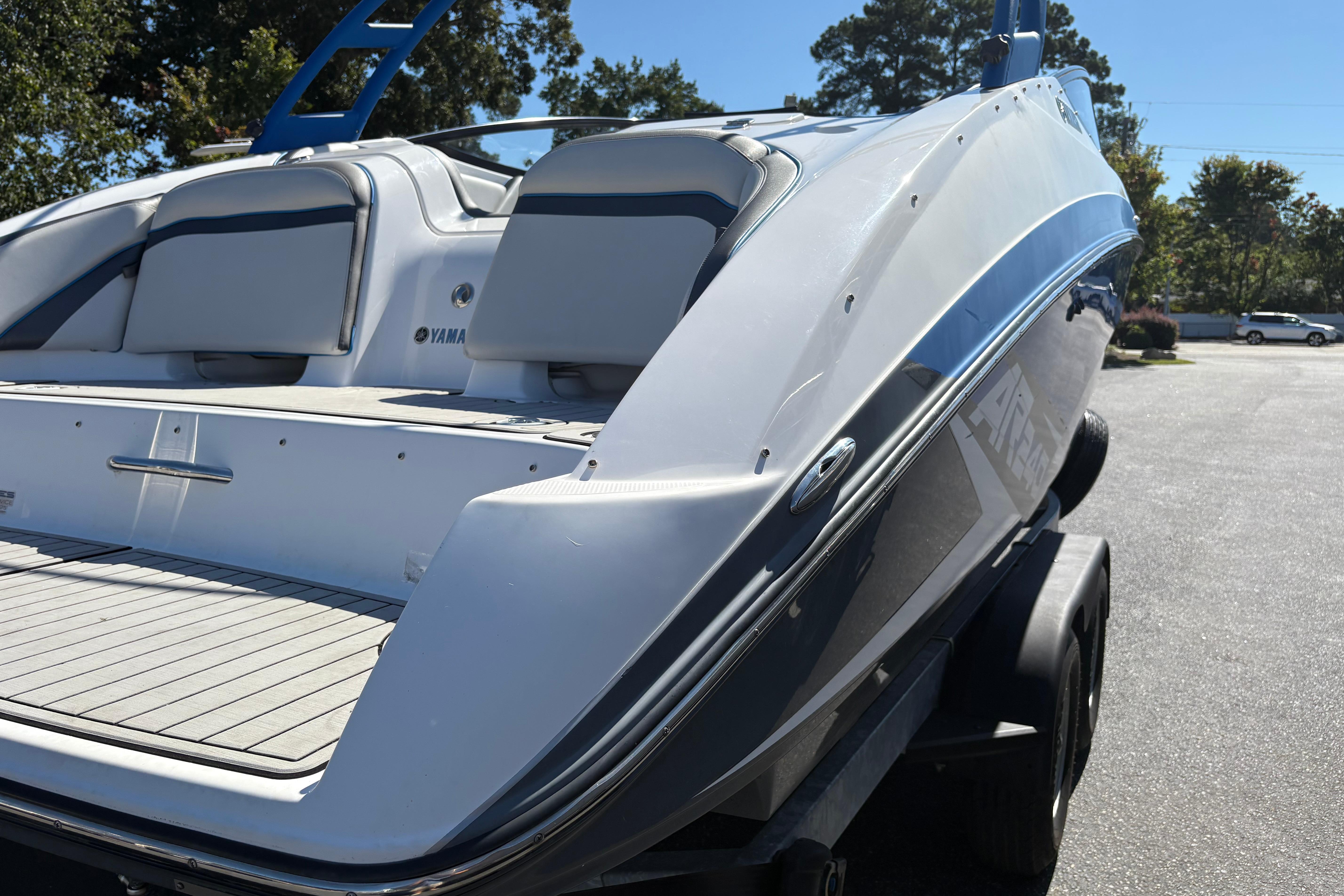 2020 Yamaha Boats AR240 on trailer, showcasing sleek design and spacious seating.