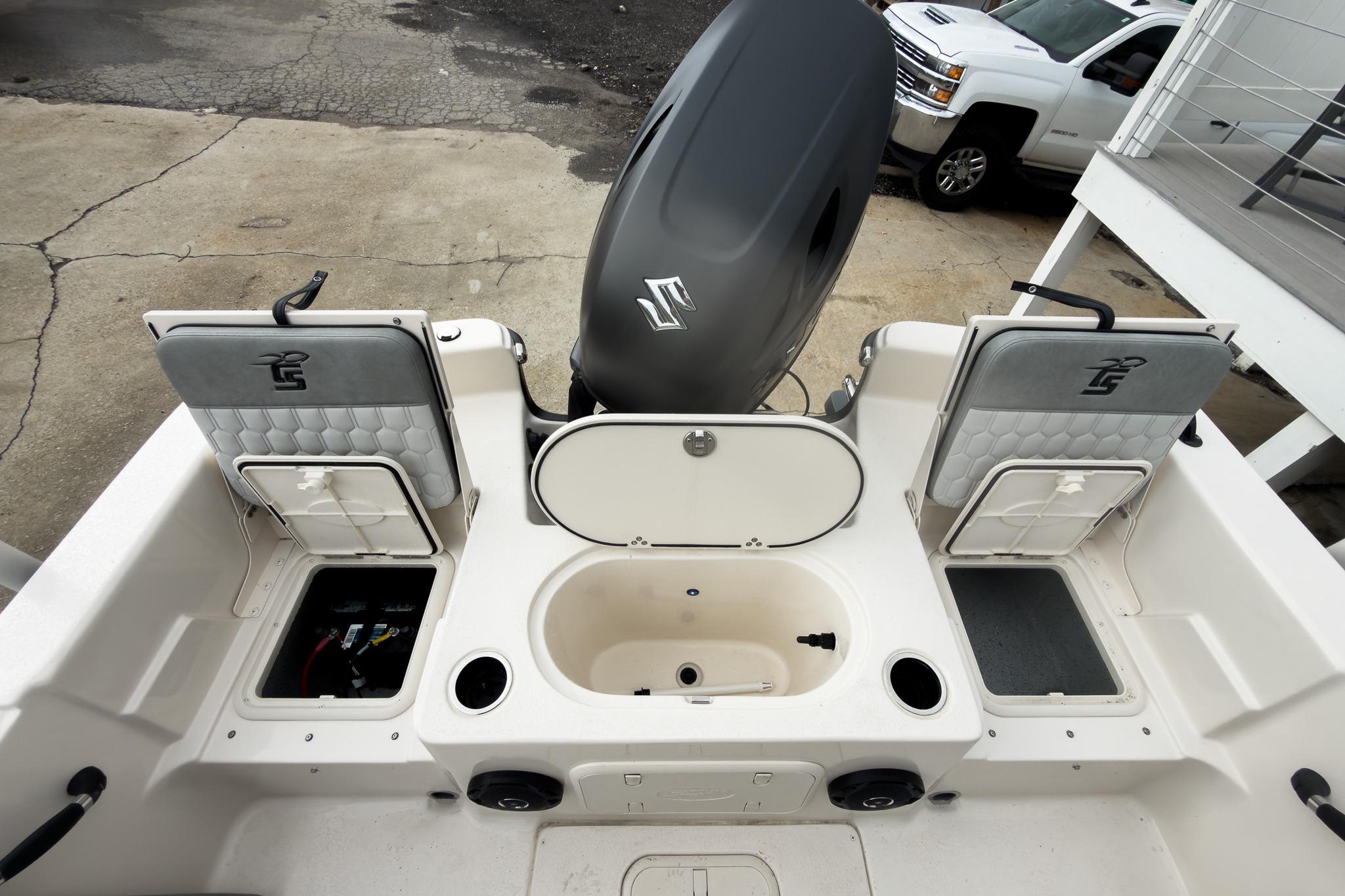 2026 Carolina Skiff 21 LS boat interior with storage compartments and motor.