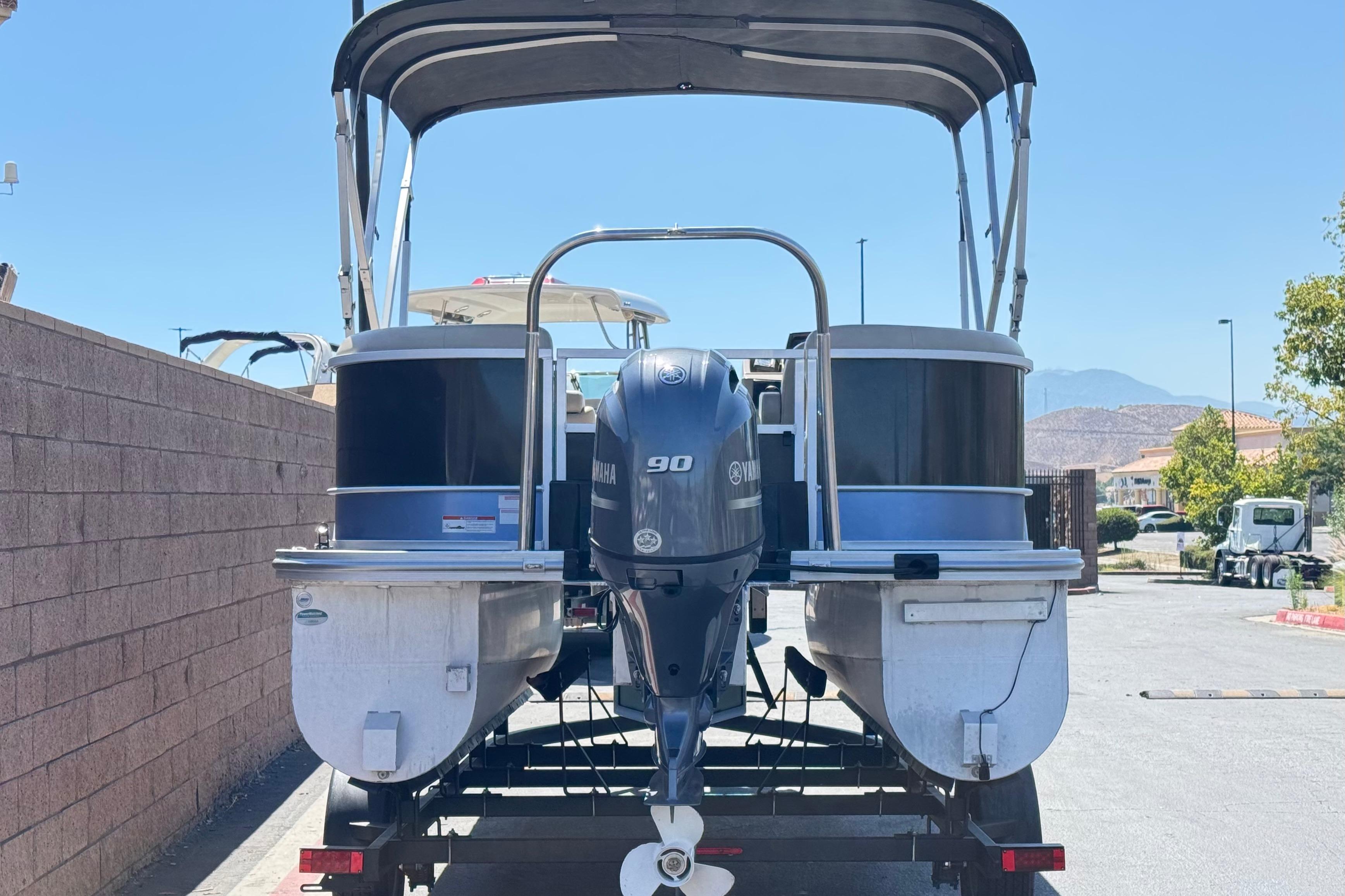 2021 SunCatcher Select 20RCX pontoon boat with Yamaha outboard motor on trailer.