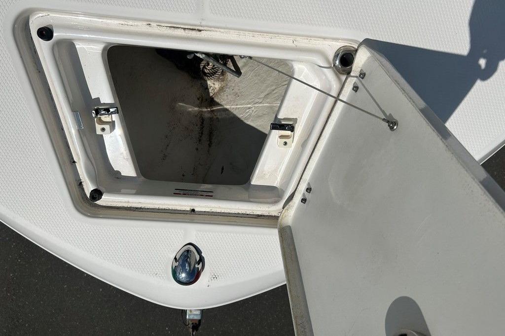 Open storage compartment on a 2017 Robalo R200ES boat deck.