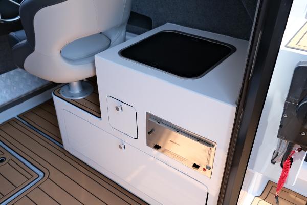 Makaira Gen3 800 boat interior, featuring a modern kitchenette and seating, 2023 model.