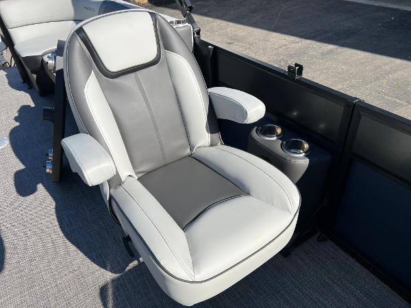 A modern, upholstered boat seat with armrests and cup holders on a Viaggio Lago 22U Tri Toon.