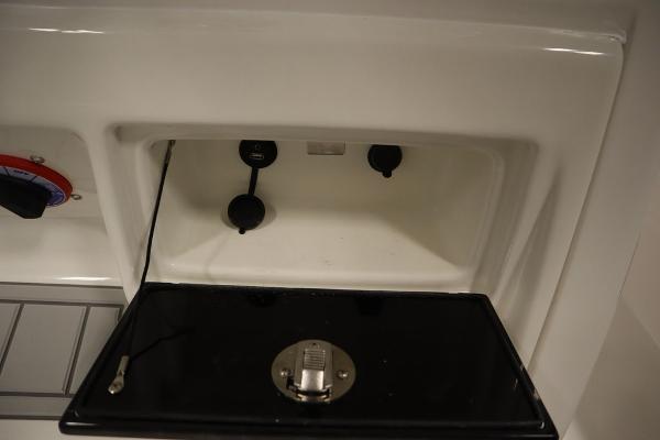 2025 Sea Fox 228 Commander boat console storage compartment.