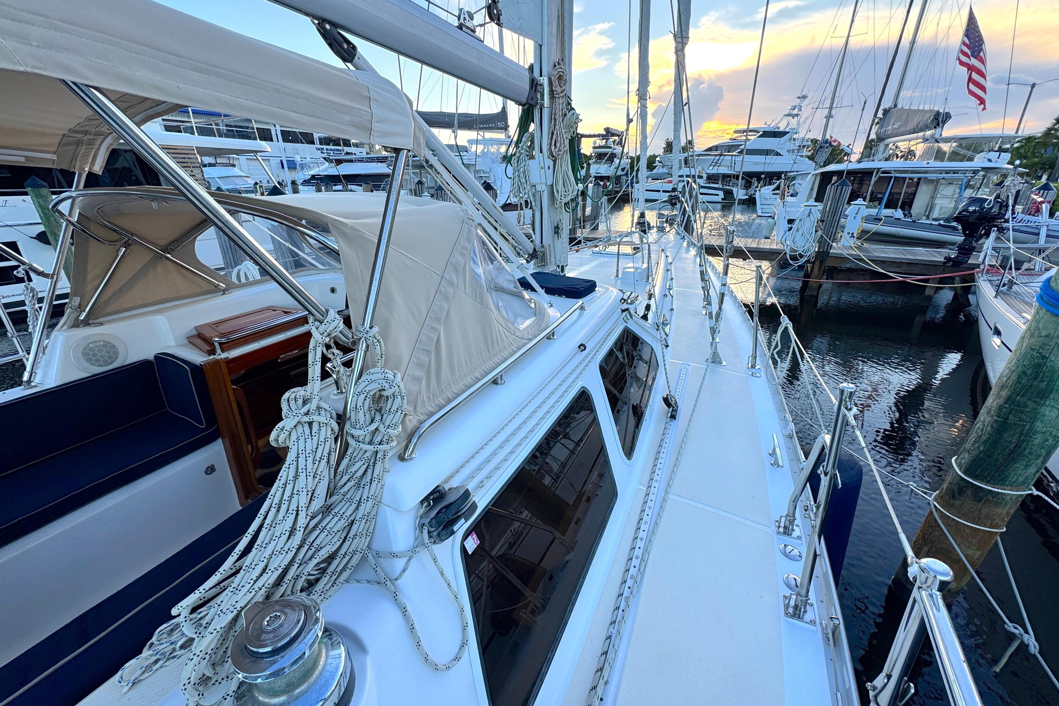 2009 Hylas 54 sailboat docked at marina during sunset.