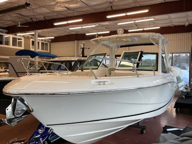 2023 Boston Whaler 280 Vantage boat displayed in a showroom.