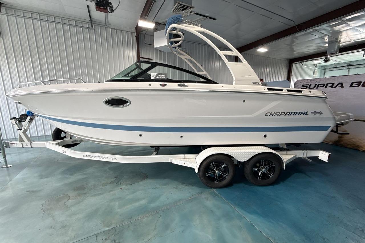 A 2026 Chaparral SSX 4 boat on a trailer inside a showroom.