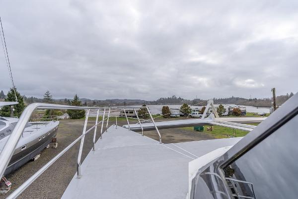 2025 Catamaran Bloomfield 86 Motorsailor on land, showcasing deck and railing.