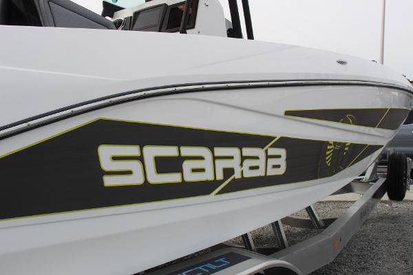 2023 Scarab 255 Open ID boat on trailer, side view.