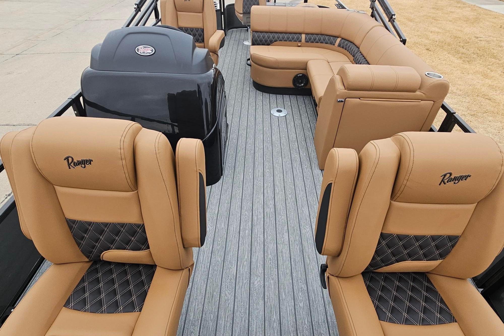 2026 Ranger 220F boat interior with tan and black diamond-stitched seating, showcasing luxury design.