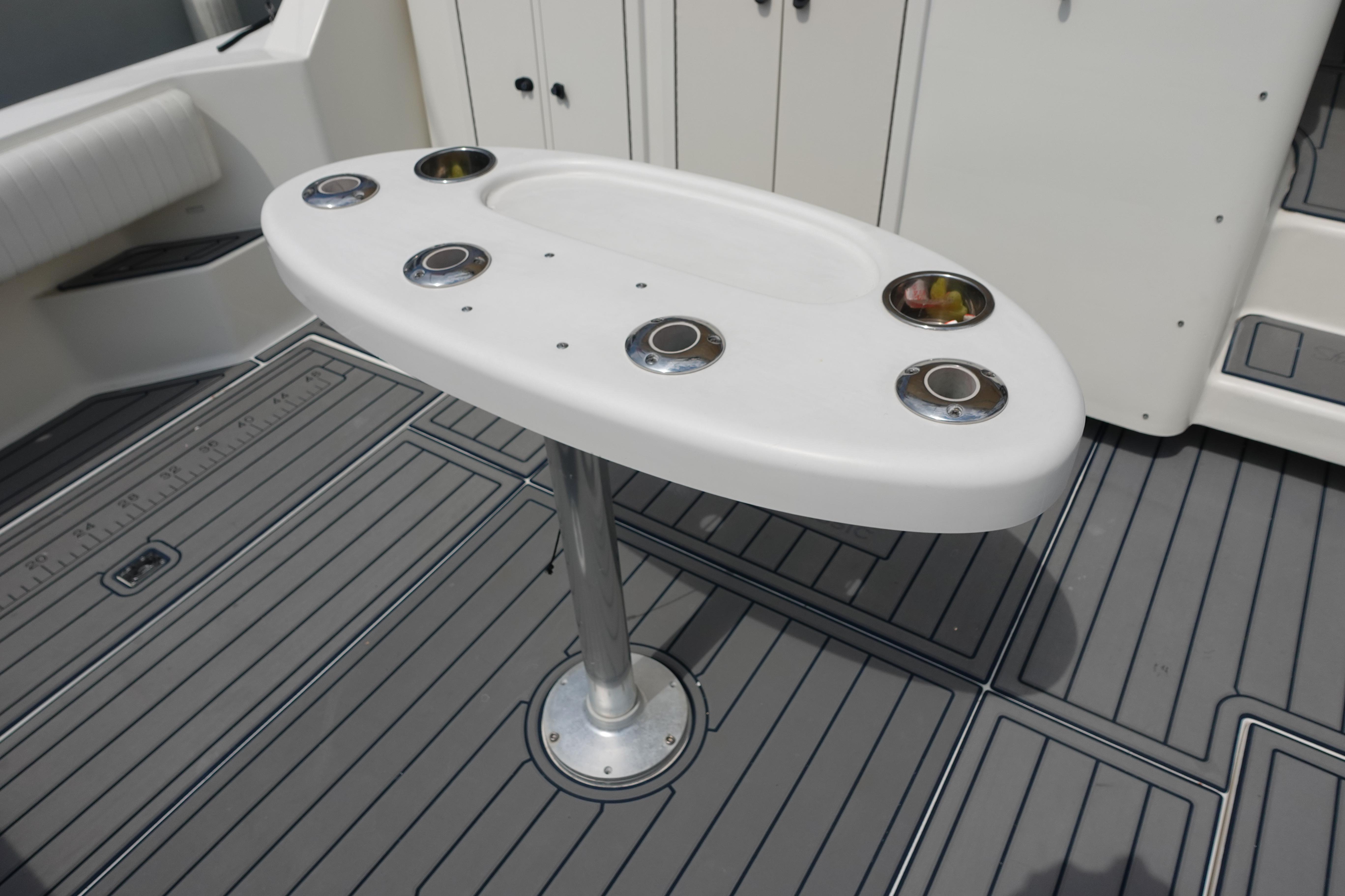 2002 Carolina Classic 35 boat deck with rod holders and non-slip flooring.