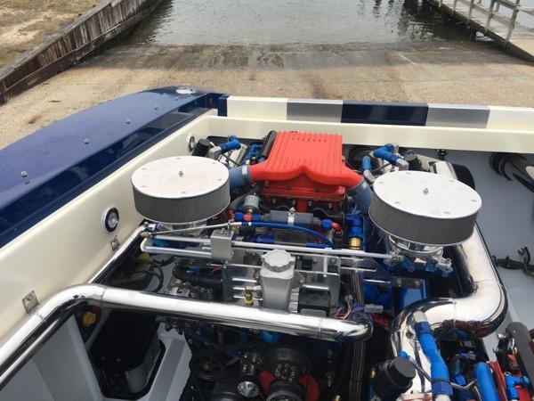 2025 Hustler 39 Rockit boat engine with dual air filters and red intake manifold.