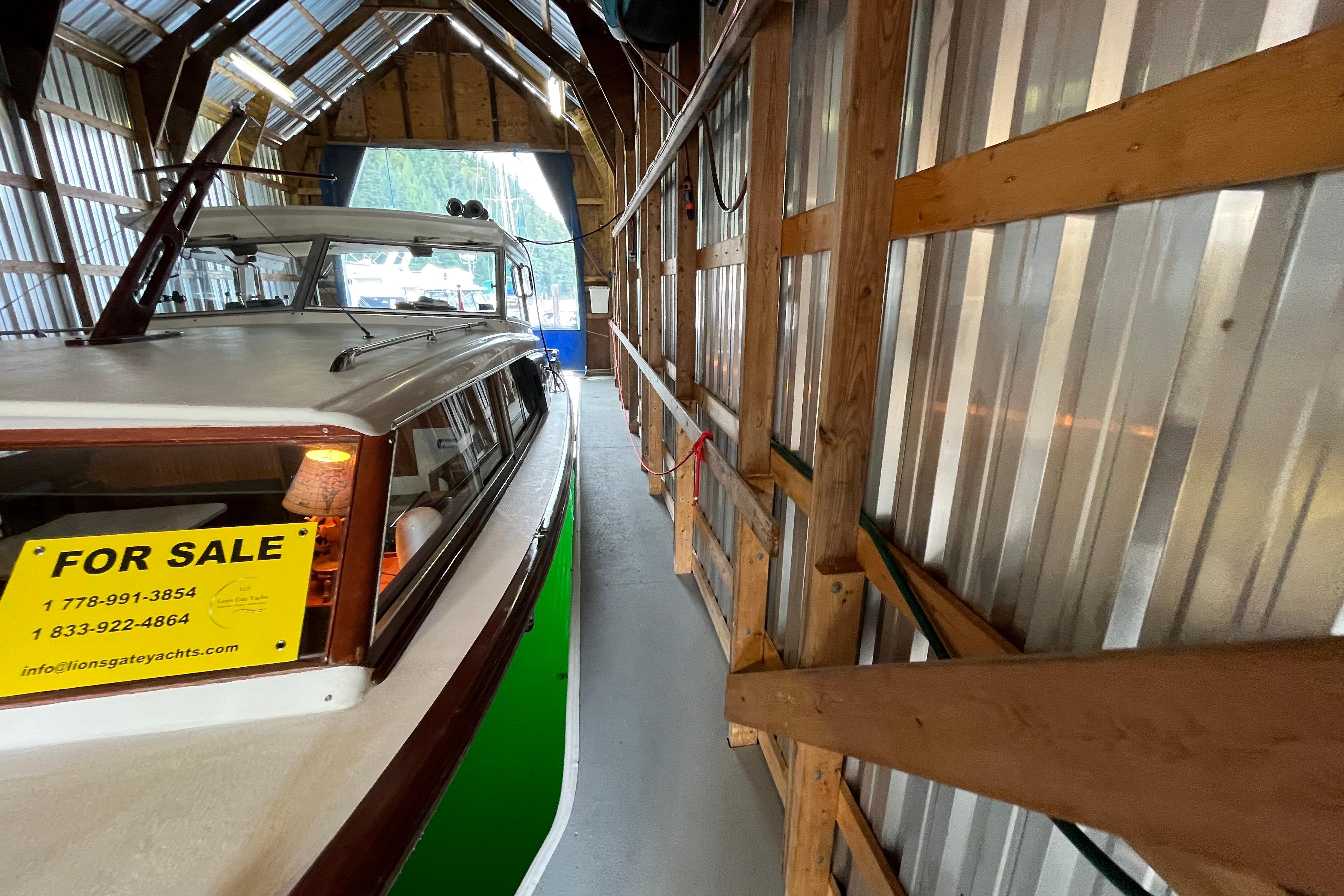 Custom Boathouse 38’X15’ for sale, docked in a wooden boathouse, 2020 model.